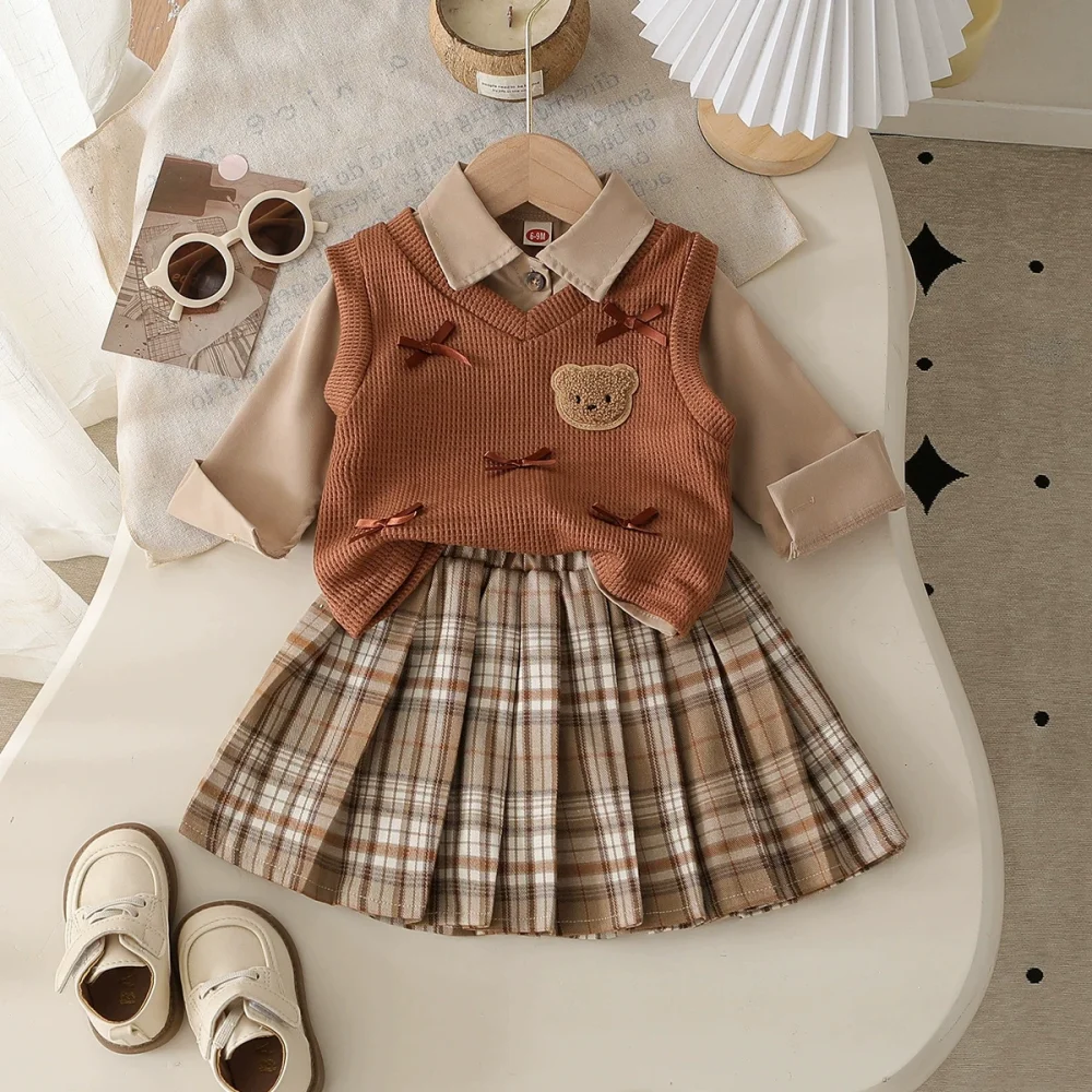 Light brown three-piece suit, shirt, vest, pleated skirt