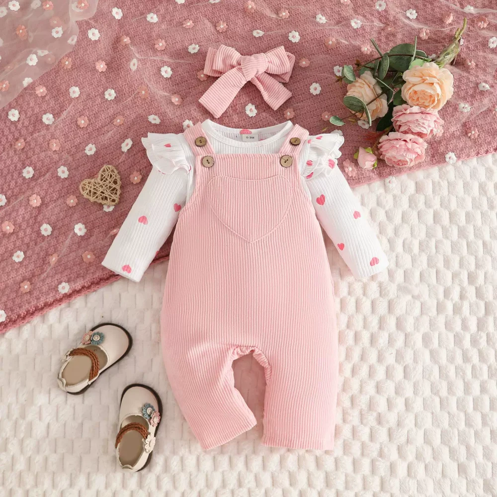 Pink overalls, khaki, hair tie