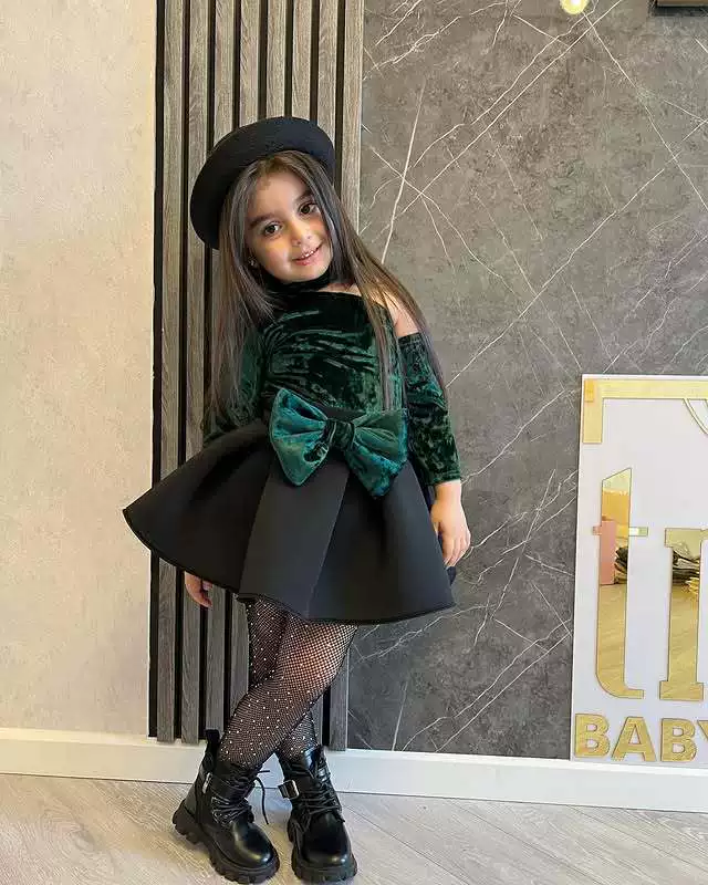 Dark green two-piece suit top and skirt