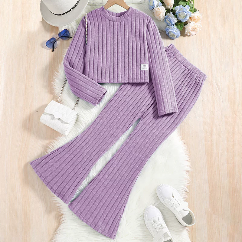Purple two-piece suit tops and bell bottoms