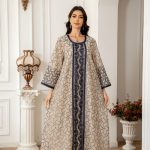 A refined abaya featuring a soft flowing silhouette with detailed patterns for a sophisticated look